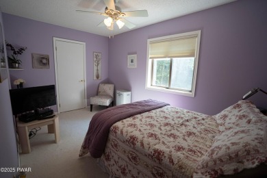 Cozy up in style in this beautifully maintained Poconos chalet on The Hideout Golf in Pennsylvania - for sale on GolfHomes.com, golf home, golf lot