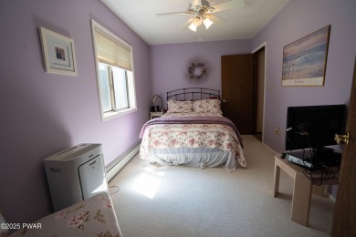 Cozy up in style in this beautifully maintained Poconos chalet on The Hideout Golf in Pennsylvania - for sale on GolfHomes.com, golf home, golf lot