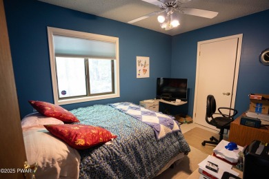 Cozy up in style in this beautifully maintained Poconos chalet on The Hideout Golf in Pennsylvania - for sale on GolfHomes.com, golf home, golf lot