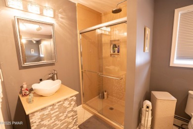 Cozy up in style in this beautifully maintained Poconos chalet on The Hideout Golf in Pennsylvania - for sale on GolfHomes.com, golf home, golf lot