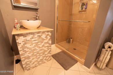 Cozy up in style in this beautifully maintained Poconos chalet on The Hideout Golf in Pennsylvania - for sale on GolfHomes.com, golf home, golf lot