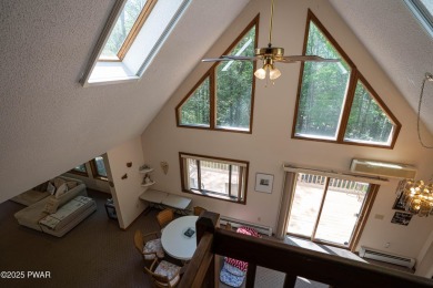 Cozy up in style in this beautifully maintained Poconos chalet on The Hideout Golf in Pennsylvania - for sale on GolfHomes.com, golf home, golf lot