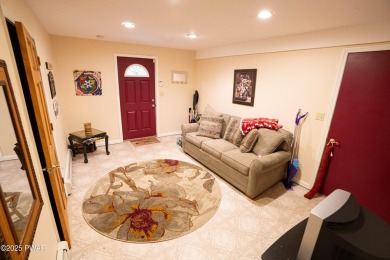 Cozy up in style in this beautifully maintained Poconos chalet on The Hideout Golf in Pennsylvania - for sale on GolfHomes.com, golf home, golf lot