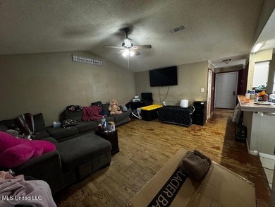 Nestled on two spacious lots, this charming 3-bedroom, 2-bath on The Kings Arrow Ranch in Mississippi - for sale on GolfHomes.com, golf home, golf lot