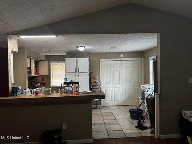 Nestled on two spacious lots, this charming 3-bedroom, 2-bath on The Kings Arrow Ranch in Mississippi - for sale on GolfHomes.com, golf home, golf lot