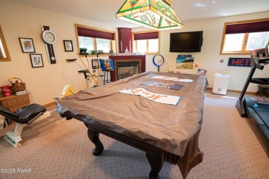Cozy up in style in this beautifully maintained Poconos chalet on The Hideout Golf in Pennsylvania - for sale on GolfHomes.com, golf home, golf lot