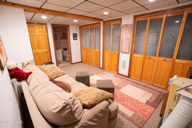 Cozy up in style in this beautifully maintained Poconos chalet on The Hideout Golf in Pennsylvania - for sale on GolfHomes.com, golf home, golf lot