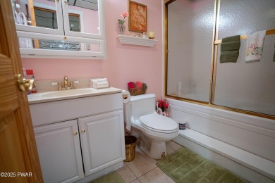 Cozy up in style in this beautifully maintained Poconos chalet on The Hideout Golf in Pennsylvania - for sale on GolfHomes.com, golf home, golf lot