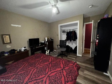 Nestled on two spacious lots, this charming 3-bedroom, 2-bath on The Kings Arrow Ranch in Mississippi - for sale on GolfHomes.com, golf home, golf lot