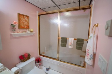 Cozy up in style in this beautifully maintained Poconos chalet on The Hideout Golf in Pennsylvania - for sale on GolfHomes.com, golf home, golf lot