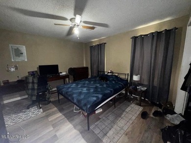 Nestled on two spacious lots, this charming 3-bedroom, 2-bath on The Kings Arrow Ranch in Mississippi - for sale on GolfHomes.com, golf home, golf lot