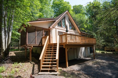 Cozy up in style in this beautifully maintained Poconos chalet on The Hideout Golf in Pennsylvania - for sale on GolfHomes.com, golf home, golf lot