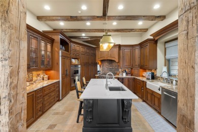 This custom home is noteworthy for its elegant stone facade on Cullasaja Club in North Carolina - for sale on GolfHomes.com, golf home, golf lot