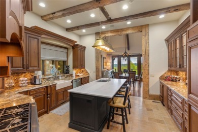 This custom home is noteworthy for its elegant stone facade on Cullasaja Club in North Carolina - for sale on GolfHomes.com, golf home, golf lot