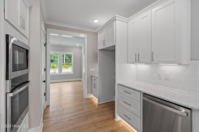 This luxury home at Tidewater at Ocean Isle Beach is now on Brick Landing Plantation Yacht and Golf Club in North Carolina - for sale on GolfHomes.com, golf home, golf lot