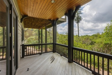 This custom home is noteworthy for its elegant stone facade on Cullasaja Club in North Carolina - for sale on GolfHomes.com, golf home, golf lot