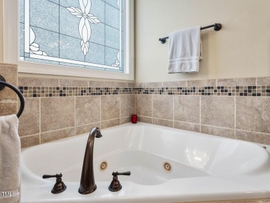 Nestled in a prestigious golf course community, this on Chapel Ridge Golf Club in North Carolina - for sale on GolfHomes.com, golf home, golf lot