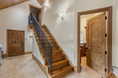 This custom home is noteworthy for its elegant stone facade on Cullasaja Club in North Carolina - for sale on GolfHomes.com, golf home, golf lot
