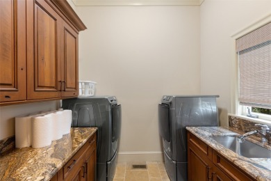 This custom home is noteworthy for its elegant stone facade on Cullasaja Club in North Carolina - for sale on GolfHomes.com, golf home, golf lot