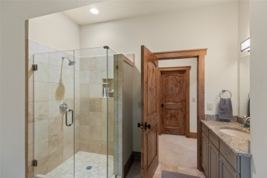 This custom home is noteworthy for its elegant stone facade on Cullasaja Club in North Carolina - for sale on GolfHomes.com, golf home, golf lot
