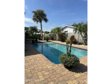 Charming Beachside Retreat with Modern Upgrades  Backyard Oasis on Oceanside Country Club in Florida - for sale on GolfHomes.com, golf home, golf lot