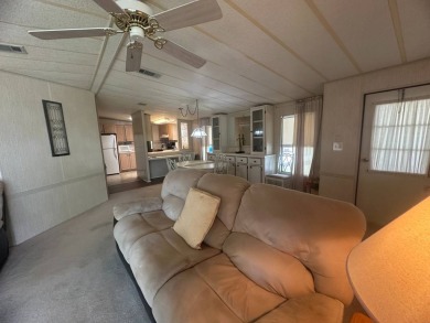 Discover incredible potential in this fully furnished home, ripe on Lake Fairways Country Club in Florida - for sale on GolfHomes.com, golf home, golf lot