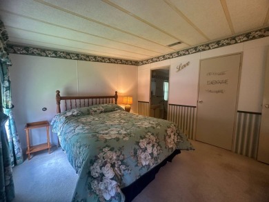 Discover incredible potential in this fully furnished home, ripe on Lake Fairways Country Club in Florida - for sale on GolfHomes.com, golf home, golf lot