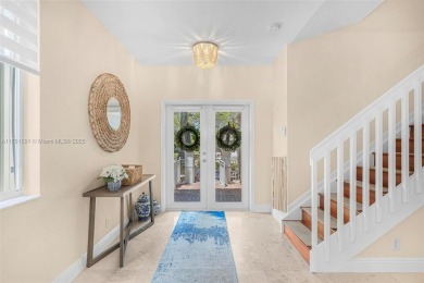 Exquisite 4BR/4BA pool home nestled on a private cul-de-sac in on Weston Hills Country Club in Florida - for sale on GolfHomes.com, golf home, golf lot