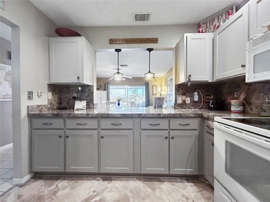 Welcome to this beautifully maintained 2-bedroom, 2-bath home on Caloosa Greens Executive Golf Course in Florida - for sale on GolfHomes.com, golf home, golf lot