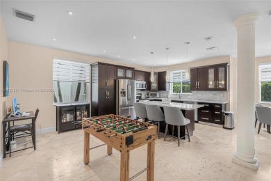 Exquisite 4BR/4BA pool home nestled on a private cul-de-sac in on Weston Hills Country Club in Florida - for sale on GolfHomes.com, golf home, golf lot