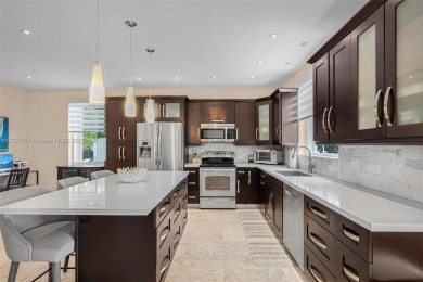 Exquisite 4BR/4BA pool home nestled on a private cul-de-sac in on Weston Hills Country Club in Florida - for sale on GolfHomes.com, golf home, golf lot
