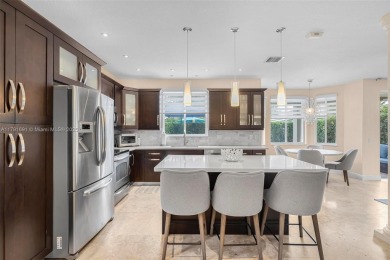 Exquisite 4BR/4BA pool home nestled on a private cul-de-sac in on Weston Hills Country Club in Florida - for sale on GolfHomes.com, golf home, golf lot