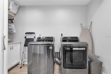 EXCEPTIONALLY RENOVATED CONTEMPORARY-COASTAL 3 BEDROOM, 2.5 BATH on Isla Del Sol Yacht and Country Club in Florida - for sale on GolfHomes.com, golf home, golf lot
