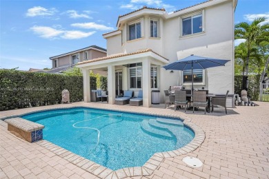 Exquisite 4BR/4BA pool home nestled on a private cul-de-sac in on Weston Hills Country Club in Florida - for sale on GolfHomes.com, golf home, golf lot