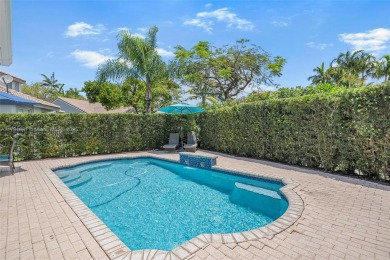 Exquisite 4BR/4BA pool home nestled on a private cul-de-sac in on Weston Hills Country Club in Florida - for sale on GolfHomes.com, golf home, golf lot