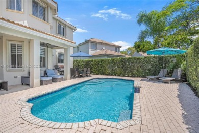 Exquisite 4BR/4BA pool home nestled on a private cul-de-sac in on Weston Hills Country Club in Florida - for sale on GolfHomes.com, golf home, golf lot