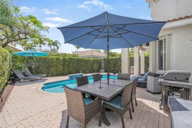 Exquisite 4BR/4BA pool home nestled on a private cul-de-sac in on Weston Hills Country Club in Florida - for sale on GolfHomes.com, golf home, golf lot