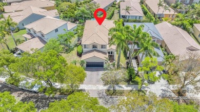 Exquisite 4BR/4BA pool home nestled on a private cul-de-sac in on Weston Hills Country Club in Florida - for sale on GolfHomes.com, golf home, golf lot