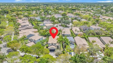 Exquisite 4BR/4BA pool home nestled on a private cul-de-sac in on Weston Hills Country Club in Florida - for sale on GolfHomes.com, golf home, golf lot