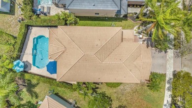 Exquisite 4BR/4BA pool home nestled on a private cul-de-sac in on Weston Hills Country Club in Florida - for sale on GolfHomes.com, golf home, golf lot