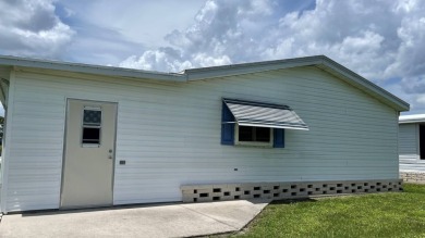 This home is located in the upscale 55+ gated community - The on Sabal Springs Golf and Racquet Club in Florida - for sale on GolfHomes.com, golf home, golf lot