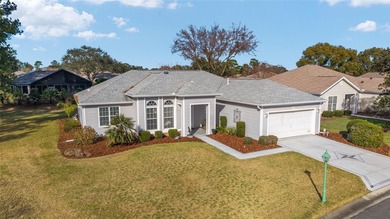 Welcome home and step into this popular Sanibel model on Eagle Ridge At Spruce Creek Country Club in Florida - for sale on GolfHomes.com, golf home, golf lot