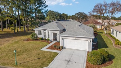 Welcome home and step into this popular Sanibel model on Eagle Ridge At Spruce Creek Country Club in Florida - for sale on GolfHomes.com, golf home, golf lot