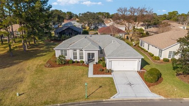Welcome home and step into this popular Sanibel model on Eagle Ridge At Spruce Creek Country Club in Florida - for sale on GolfHomes.com, golf home, golf lot