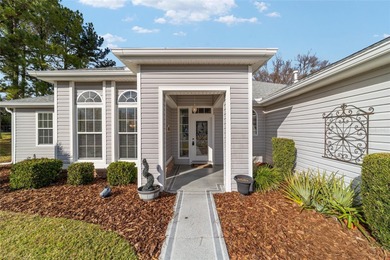 Welcome home and step into this popular Sanibel model on Eagle Ridge At Spruce Creek Country Club in Florida - for sale on GolfHomes.com, golf home, golf lot
