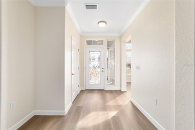 Welcome home and step into this popular Sanibel model on Eagle Ridge At Spruce Creek Country Club in Florida - for sale on GolfHomes.com, golf home, golf lot