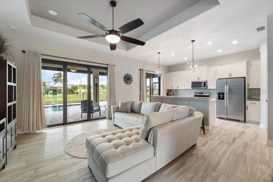 Welcome to your dream home on a freshwater canal in the highly on Pinemoor West Golf Club in Florida - for sale on GolfHomes.com, golf home, golf lot