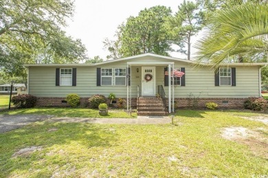 Just a short golf cart ride away from beautiful Garden City on Indigo Creek Golf Club in South Carolina - for sale on GolfHomes.com, golf home, golf lot