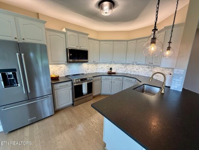 Discover one of the most desirable condos in Rarity Bay on Rarity Bay Country Club - Loudon in Tennessee - for sale on GolfHomes.com, golf home, golf lot