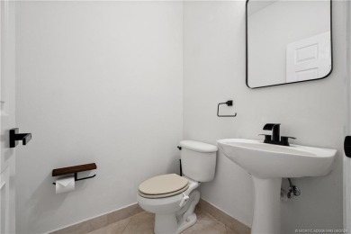 STUNNING 3-bed + bonus loft home in Jensen Beach Country Club on Eagle Marsh Golf Club in Florida - for sale on GolfHomes.com, golf home, golf lot